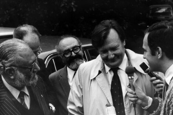 Salam and Rubbia at the Nobel Prize interview, 1984 Physicist Carlo Rubbia is being interviewed by a reporter. He stands next to Abdus Salam and L. Stasi. Rubbia's expression is one of happiness and shyness.