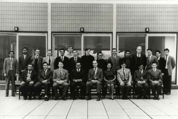 Imperial College London Theoretical Physics Group, 1983 Members of the Imperial College London Theoretical Physics Group sitting and standing together in two rows.