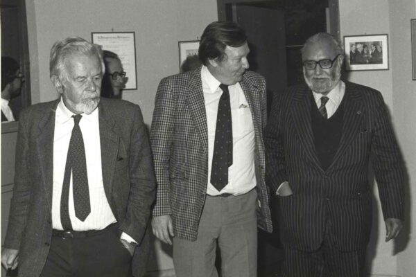 Salam and Rubbia, 1984 Abdus Salam standing with physicist Carlo Rubbia and P. Budinich. They seem to be walking somewhere whilst engaged in conversation.