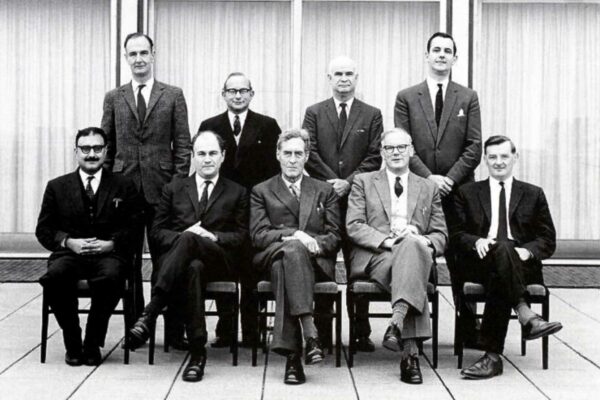 Imperial College London Physics professors, 1964 A group of Imperial College London Physics professors sitting together, posing for a departmental photograph. Everyone is smiling except for Blackett, who looks quite solemn and serious.